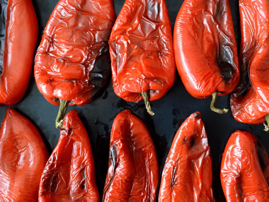 To blister peppers in the oven, prep your favorite pepper with a little bit of oil and place it on a cooking sheet.