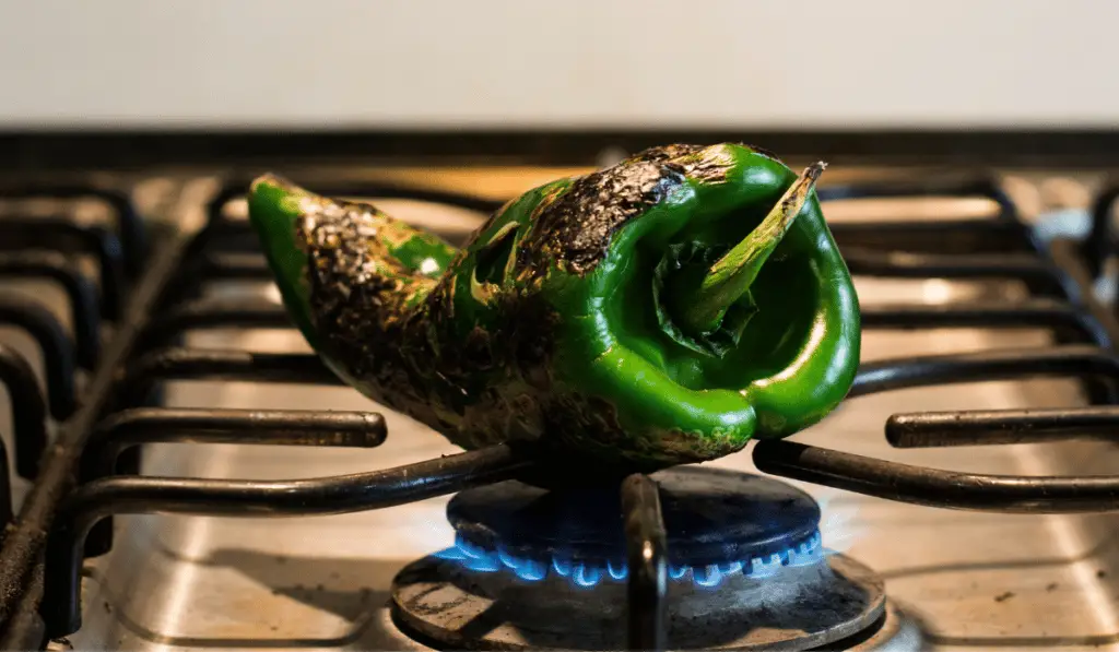 Blistering poblano peppers is the best way to remove the unpleasant thick outer skin.
