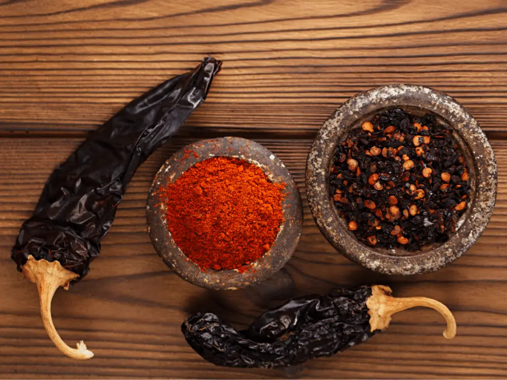 Chipotle peppers are a versatile ingredient at every stage: dried pepper, roughly crushed, and finely ground.